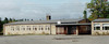 SAK00252_Stockholm, Bredäng, Tankebyggarorden 2, Björksätravägen 22-48. 

Den västligaste byggnaden, tidigare skolans matsal, från öster. Notera hur skärmtak binder samman husen på skolgårdens västra sida.