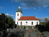 Kyrkan och kyrkogården mot öster.