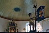 Kerub med timglas på predikstolen i Tengene kyrka. Neg.nr. 03/299:04. JPG.