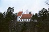 Viskafors kyrka är högt belägen på en skogig bergsrygg över brukssamhället Viskafors. Kyrkan sedd från sydöst. 