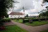 Hålanda kyrka med omgivande kyrkogård sedd från N.