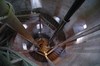Skara vattentorn. Trappan och vattenledningar till cisternen i tornets topp, sedda uppifrån.