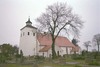 Onsala kyrka med omgivande kyrkogård sedd från sydväst.