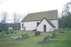 Hanhals kyrka med omgivande kyrkogård sedd från norr.
