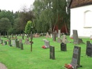Kyrkogårdens östra sida med ett blandat vårdbestånd från olika epoker.