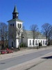 Anderstorps kyrka mittemot kommunhuset och
däremellan norra infarten till samhället.