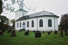 Sjötofta kyrka med omgivande begravningsplats sedd från sydöst.