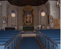 Lima kyrka, interiör bild av kyrkorummet, bänkrader och altargång sett mot koret i öster. 