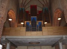 Orgelläktaren i väster byggdes 1963 i modernistisk stil efter arkitekt Gösta Lilliemarcks ritningar. Den vilar på två betongpelare med sandblästrade och slipade ytor. Barriären och orgelfasaden är helt plana, utförda i lackad ek. Bakomvarande rum i tornet används av kyrkomusiker och kör. Dessutom finns mindre arbetsrum.        