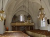 Interiör, kyrkorummet.
Orgelläktaren.
Svedvi kyrkas läktare förstorades 1956, orgeln nybyggdes 1957, allt efter arkitekt Einar Lundbergs ritningar. Dessförinnan fanns en orgel från 1897 i nygotik och på läktaren rymdes ingen kör. Med den nya orgelns genombrutna fasad kunde kyrkorummet åter belysas av västra gavelns medeltida fönster.  