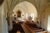Kyrkorummet uppvisar en mängd tidsskikt, från långhusets medeltida valv och väggmålningar via 1600-talets predikstol, 1700-talets korsarmar och kor till 1800-talets altartavla och 1950-talets fasta inredning. 