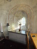 Fleninge kyrka, absiden med romans dörröppning i öster och kalkmålningar från 1300-talet.
