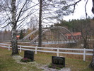 Lögdö kyrka/Lögdö brukskapell, kyrkogården med omgivning, bron över ån.  