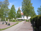 Edsele kyrka med omgivande kyrkogård, vy från sydöst. 