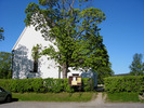 Skogs kyrka med omgivande kyrkogård, vy från nord öst. 