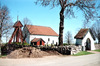 Valtorps kyrka med kyrkogården, vy från söder. 