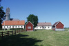 Gothem Prästgård. Till vänster (framför sockenkyrkan) syns 1860-talsbyggnaden som innehåller medeltida delar.