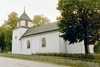 Väne-Ryrs kyrka är belägen helt nära landsvägen. Tornet uppfördes först 1902, ovanligt nog anslutet till koret i öster och med en sakristia i bottenvåningen.
