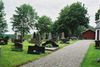 Kyrkogården söder om kyrkan. Foto från öster.