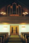Dalstorps kyrka sedd mot läktaren i väster med orgel.