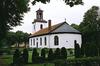 Fritsla kyrka med omgivande kyrkogård, från SÖ.