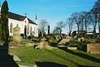 Kyrkogården söder om Kinna kyrka, från V.