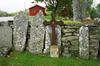 Äldre gravstenar resta vid den Tostareds norra kyrkogårdsmur, från S.
