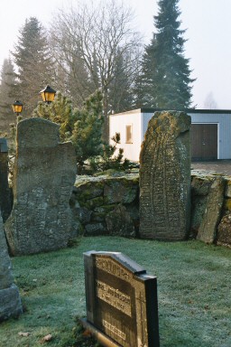Runstenar och romansk locksten på Blidsbergs kyrkogård. Neg.nr. B963_019:22. JPG. 