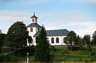 Mjöbäcks kyrka sedd från gamla kyrkogården i sydöst, från SÖ.