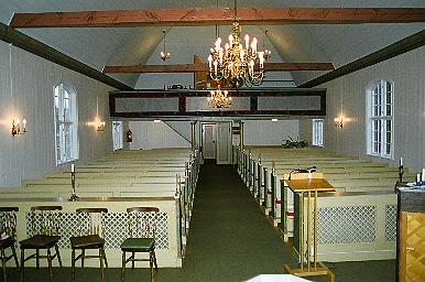 Kyrkorummet i Svenasjö kyrka sett från koret mot läktaren i väster, från Ö.