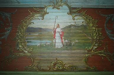 Motivet "Den gode herden" med Sätila kyrka i fonden, i södra korsarmen, från Ö.