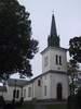 Näsby kyrka, exteriör med västtorn i förgrunden. 