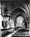 Kyrkorummet före 1905 års restaurering. Bänkinredningen var av 
den traditionella, slutna 1700-talsmodellen. Korfönstret hade 
kvar sin form från 1786. 
